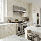 Modern kitchen with cream cabinets, marble countertops, Proline 48" All-Gas Range, PLJW 109 Hood—save 10% at ProlineRangeHoods.com.