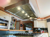 Check out a modern kitchen at ProlineRangeHoods.com featuring the Proline PLJI 103 Island Range Hood with a sleek finish.