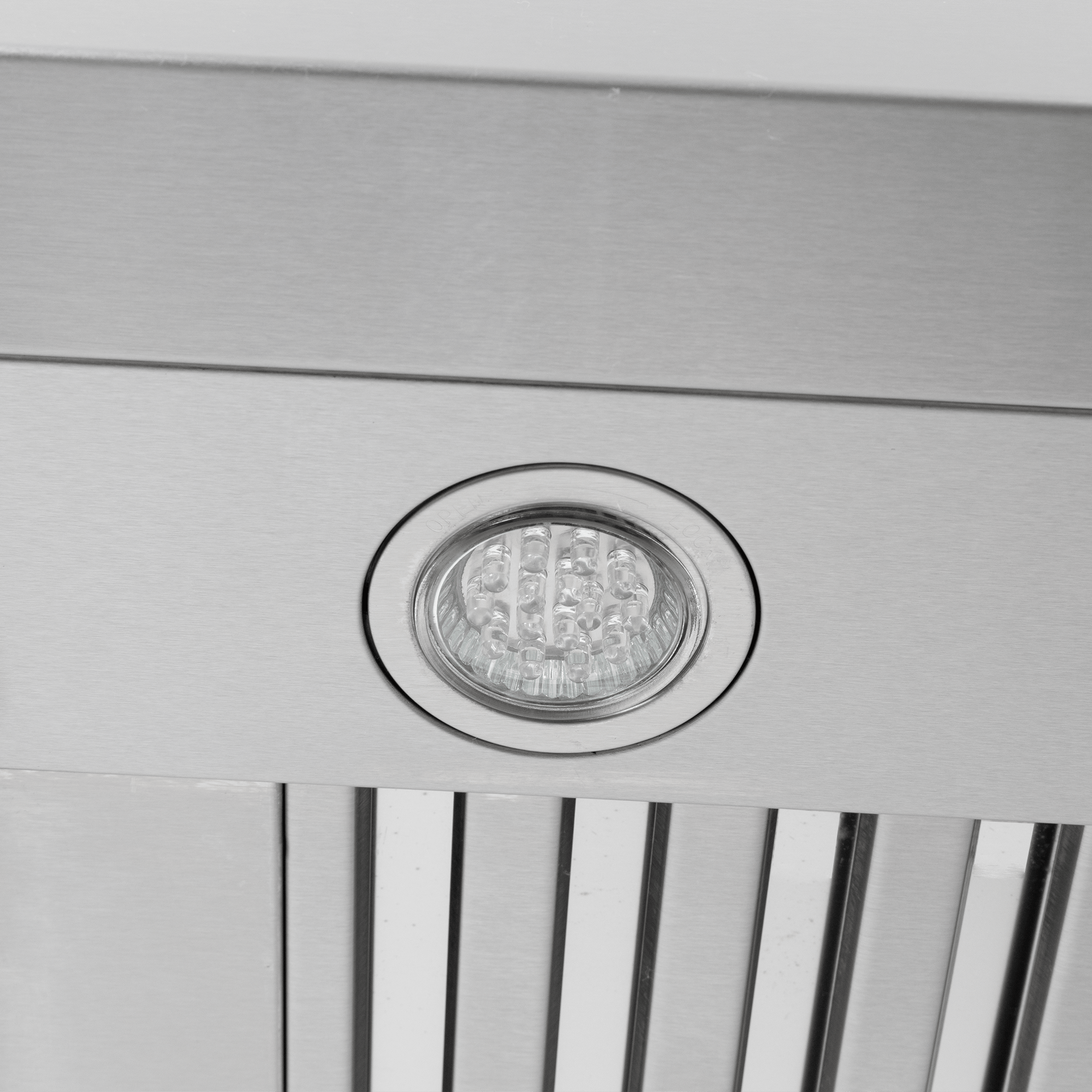 Close-up of round LED light in stainless steel with vent slats, on Proline King Air Range Hood. ProlineRangeHoods.com.
