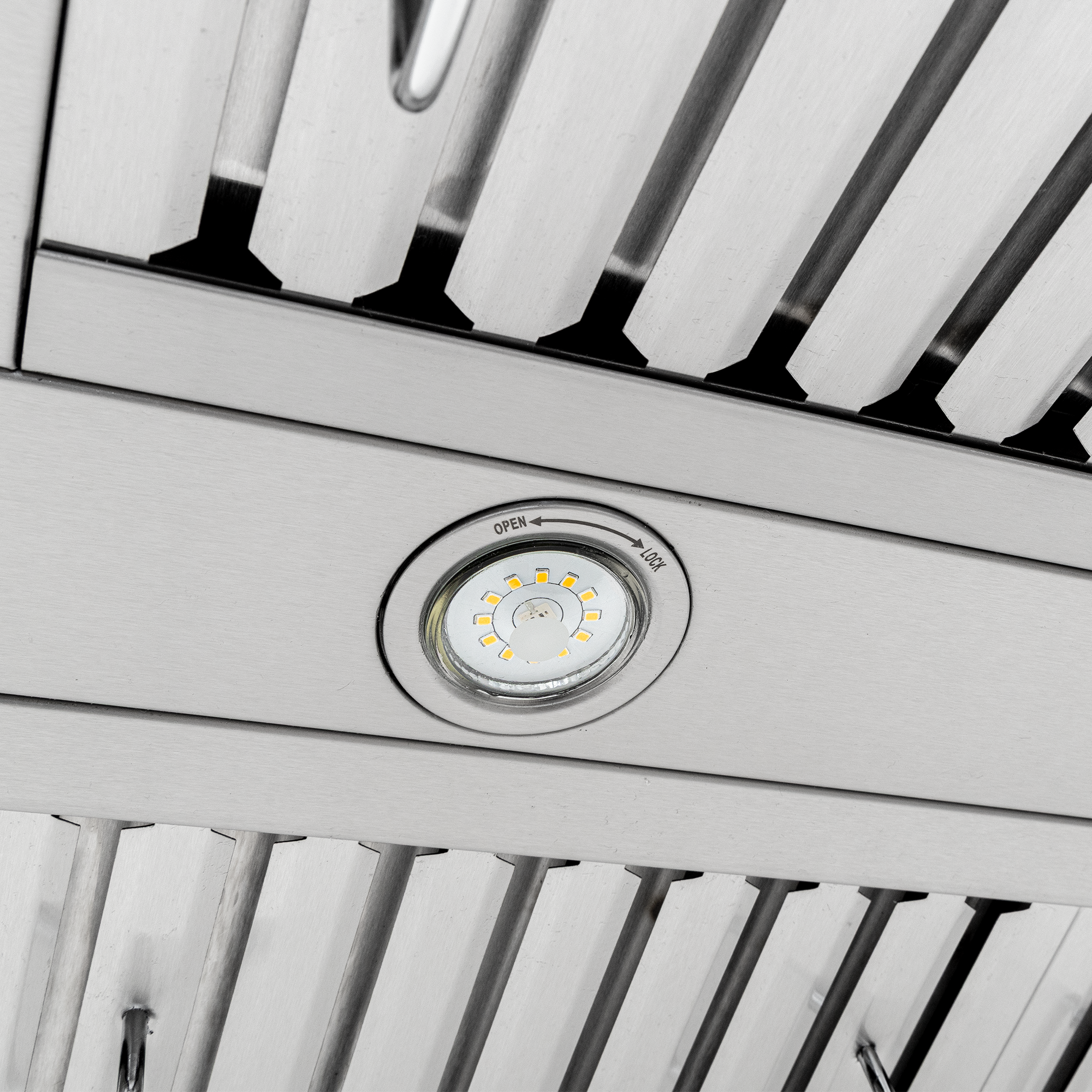 Close-up of Proline PLFW 755 range hood with circular light, stainless steel, 1100 CFM. ProlineRangeHoods.com.