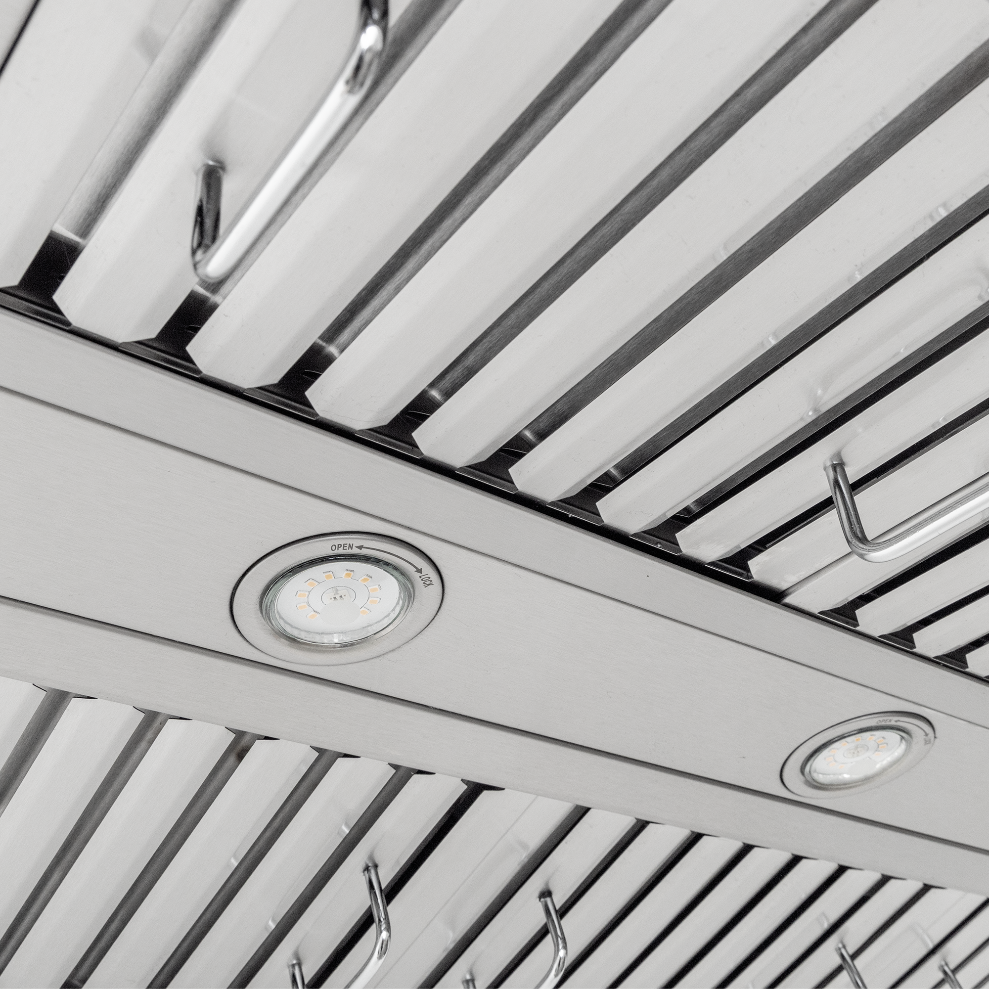 Close-up of Proline PLFW 755 range hood: stainless steel, slatted vents, dual motors, 1100 CFM. ProlineRangeHoods.com.