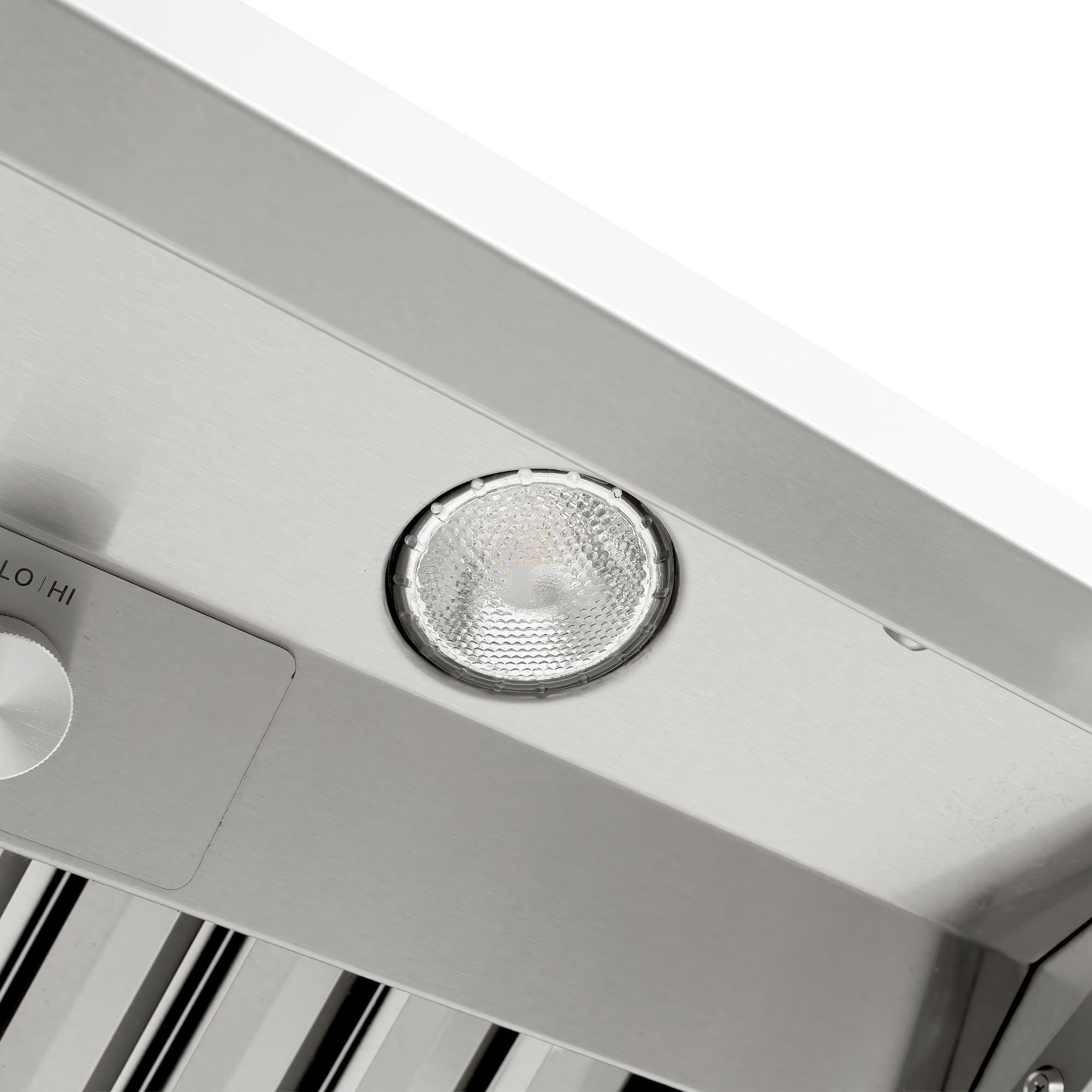 Round light fixture on Proline Range Hoods PLGW 104 HE in stainless steel, control knob visible. ProlineRangeHoods.com.