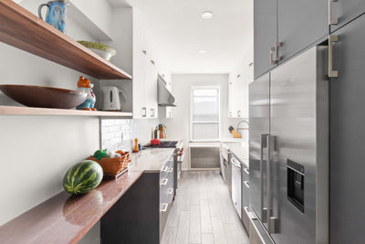Customer kitchen with the Proline PLJW 109 - Wall-Mounted Range Hood, 1000/2000 CFM | Convertible to Ductless, Stainless Steel Finish, Outdoor Rated