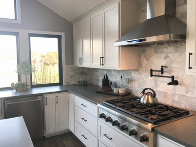 Customer kitchen with the Proline PLFW 129 E - Wall-Mounted Range Hood, 900 CFM | Stainless Steel Design