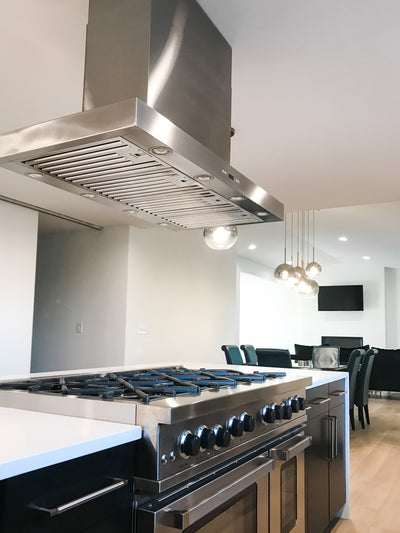 Customer kitchen with the Proline PLFI 750 - Island Range Hood, 1100 CFM | Stainless Steel Finish