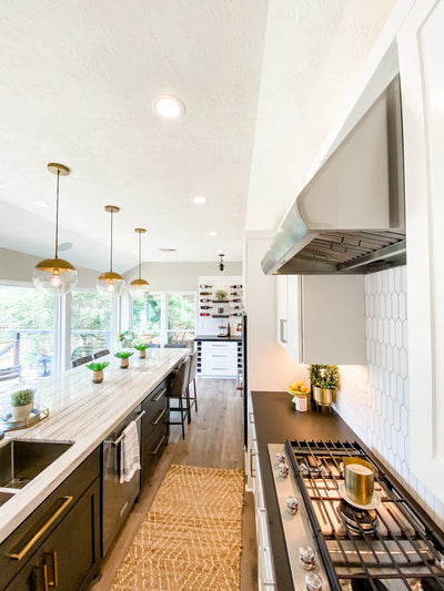 Customer kitchen with the Proline PLJW 109 - Wall-Mounted Range Hood, 1000/2000 CFM | Convertible to Ductless, Stainless Steel Finish, Outdoor Rated