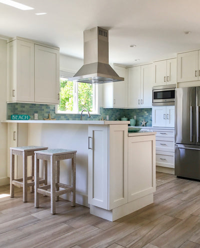 Customer kitchen with the Proline PLFI 520 - Ducted Island Range Hood, 600/1100 CFM | Stainless Steel Finish