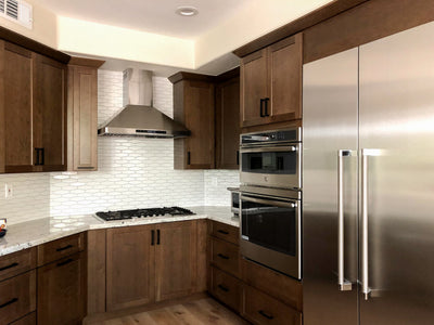 Customer kitchen with the Proline PLFW 129 E - Wall-Mounted Range Hood, 900 CFM | Stainless Steel Design