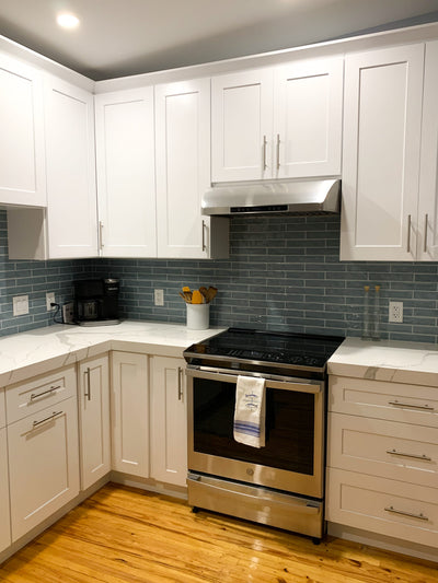 Customer kitchen with the Proline PLJW 117 - Under-Cabinet Range Hood, 900 CFM Stainless Steel Finish