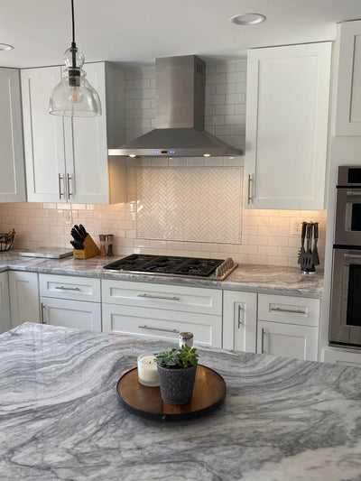 Customer kitchen with the Proline PLFW 520 - Wall-Mounted Range Hood, 600/1200 CFM | Convertible to Ductless, Stainless Steel, Matte Black Finish