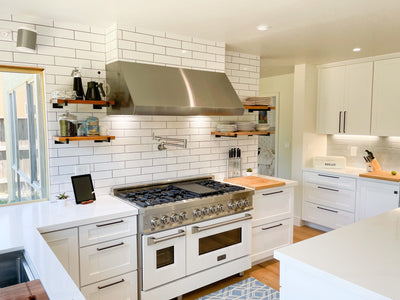 Customer kitchen with the Proline PLJW 109 - Wall-Mounted Range Hood, 1000/2000 CFM | Convertible to Ductless, Stainless Steel Finish, Outdoor Rated