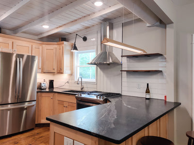 Customer kitchen with the Proline Vector - Ducted Wall-Mounted Range Hood, 600 CFM | Stainless Steel Finish