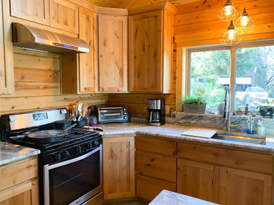 Customer kitchen with the Proline PLJW 117 - Under-Cabinet Range Hood, 900 CFM Stainless Steel Finish