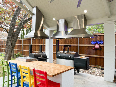 Customer kitchen with the Proline ProVI - Ducted Island Range Hood, Variable CFM | Stainless Steel, Outdoor Rated Finish Option