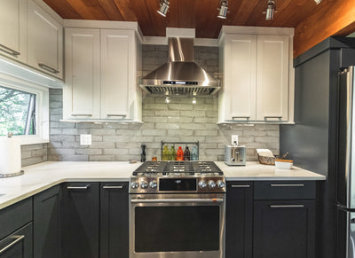 Customer kitchen with the Proline PLFW 129 E - Wall-Mounted Range Hood, 900 CFM | Stainless Steel Design