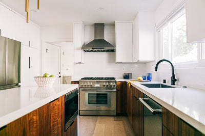 Customer kitchen with the Proline PLFW 129 E - Wall-Mounted Range Hood, 900 CFM | Stainless Steel Design