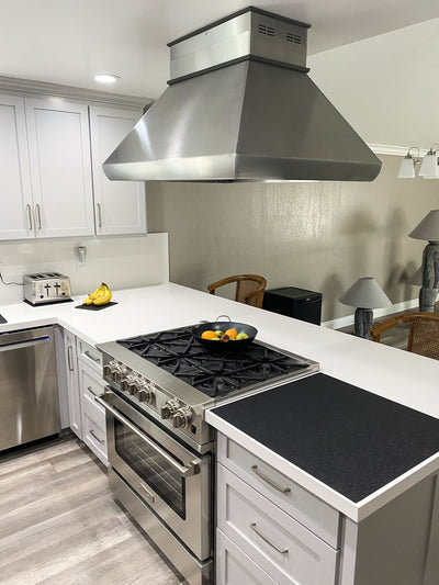 Customer kitchen with the Proline PLJI 109 - Ducted Island Range Hood, 1200 CFM | Stainless Steel Finish