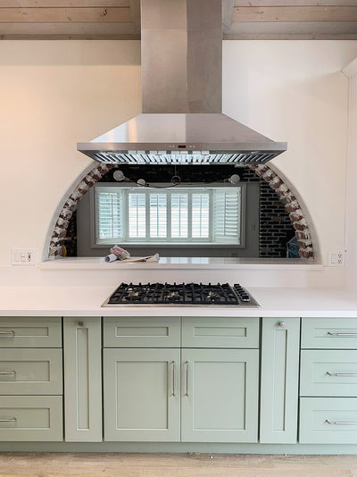 Customer kitchen with the Proline PLFI 520 - Ducted Island Range Hood, 600/1100 CFM | Stainless Steel Finish