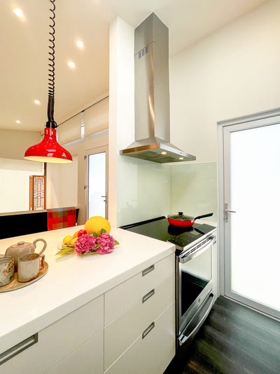 Customer kitchen with the Proline PLFW 520 - Wall-Mounted Range Hood, 600/1200 CFM | Convertible to Ductless, Stainless Steel, Matte Black Finish