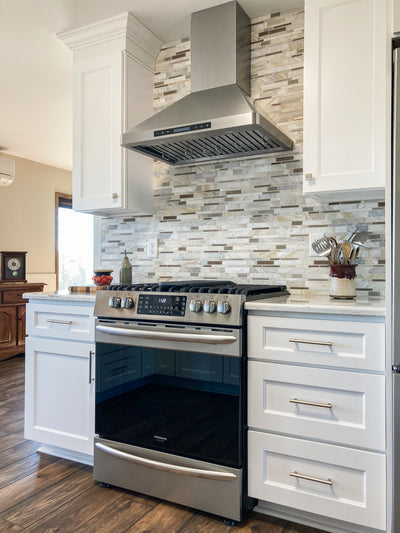 Customer kitchen with the Proline PLFW 129 E - Wall-Mounted Range Hood, 900 CFM | Stainless Steel Design