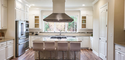 Customer kitchen with the Proline PLJI 109 - Ducted Island Range Hood, 1200 CFM | Stainless Steel Finish