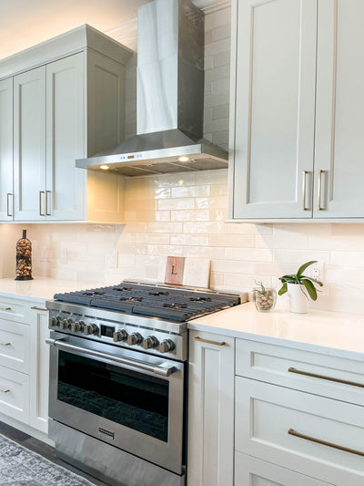 Customer kitchen with the Proline PLFW 520 - Wall-Mounted Range Hood, 600/1200 CFM | Convertible to Ductless, Stainless Steel, Matte Black Finish