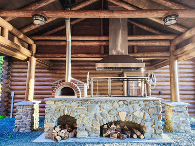 Customer kitchen with the Proline ProVI - Ducted Island Range Hood, Variable CFM | Stainless Steel, Outdoor Rated Finish Option