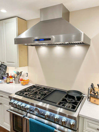 Customer kitchen with the Proline PLJW 130 - Ducted Wall-Mounted Range Hood, 900/1200 CFM | Stainless Steel Finish