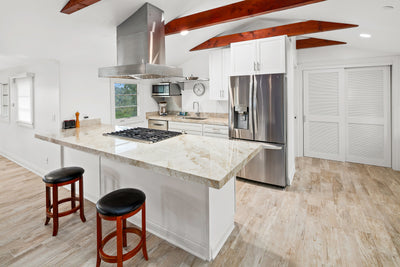 Customer kitchen with the Proline PLFI 755 - Island Range Hood, 1100 CFM | Stainless Steel, Outdoor Rated Finish Option