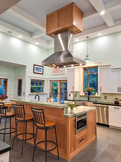 Customer kitchen with the Proline ProVI - Ducted Island Range Hood, Variable CFM | Stainless Steel, Outdoor Rated Finish Option