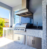 Proline PLJW 104 range hood and stainless grill in a tiled patio kitchen. See ProlineRangeHoods.com.