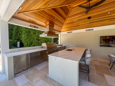 Customer kitchen with the Proline ProVI - Ducted Island Range Hood, Variable CFM | Stainless Steel, Outdoor Rated Finish Option