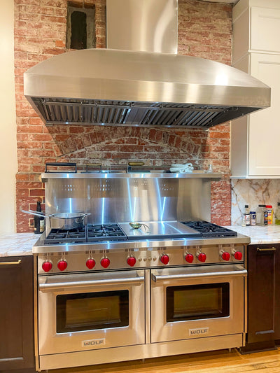 Customer kitchen with the Wall Mounted Range hood, Ducted, 2000 CFM, Thick 304 Stainless Steel | PLGW WC BBQ Pro
