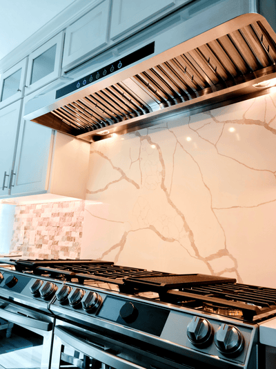 Customer kitchen with the Proline PLJW 101 - Ducted Under-Cabinet Range Hood, 1000/2000 CFM | Stainless Steel Finish
