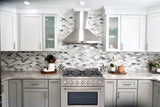 Discover a modern kitchen at ProlineRangeHoods.com with a Dual Fuel Range, perfect with hexagonal tile and glass cabinets.