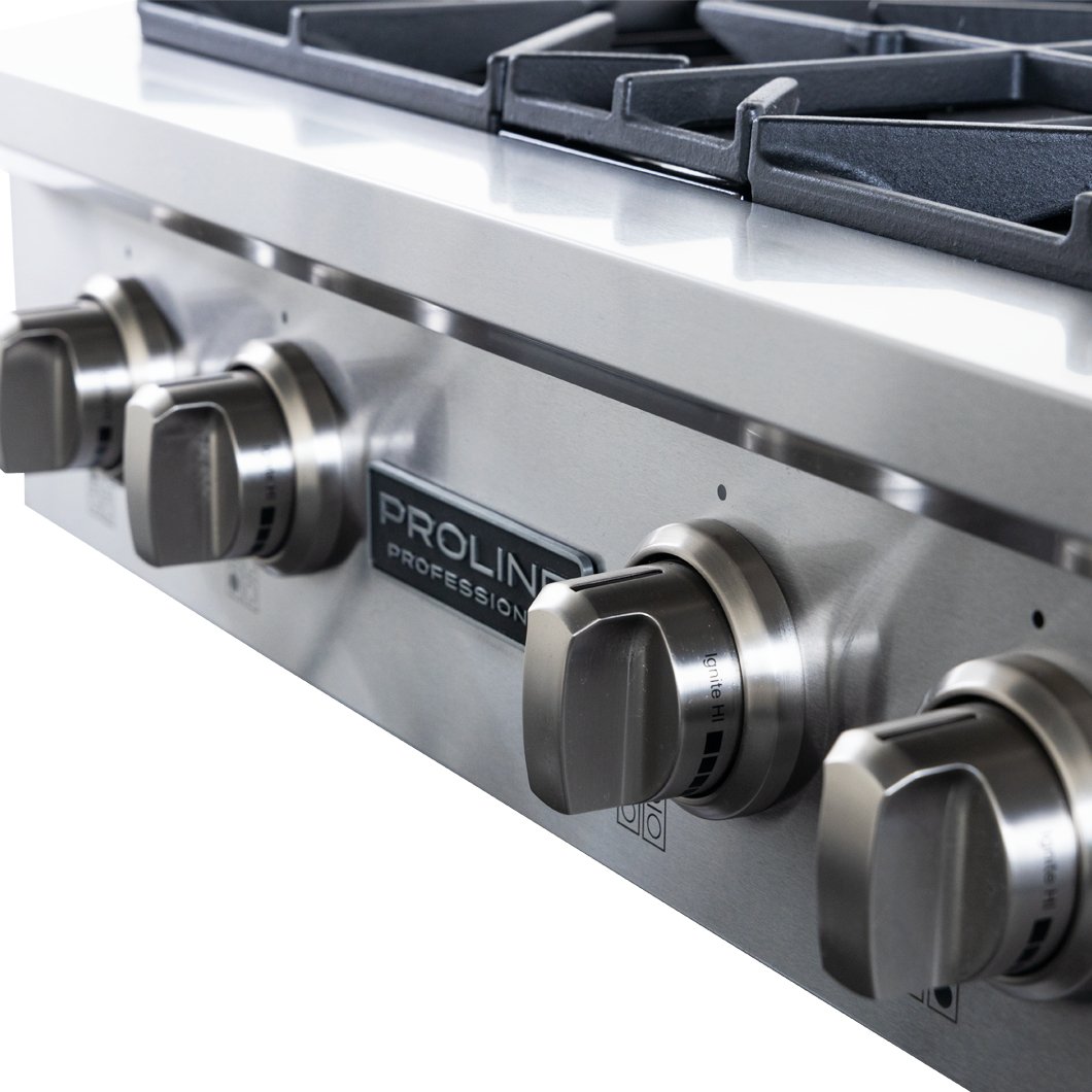 Close-up of four stainless steel knobs on the Proline PLST Gas Range—15,000 BTUs compact design. ProlineRangeHoods.com.