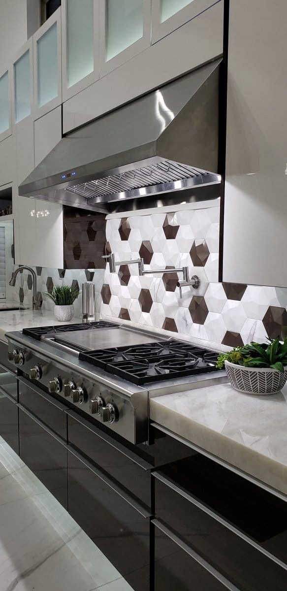 Contemporary kitchen with a Proline PLFW 832 from ProlineRangeHoods.com, featuring quiet stainless steel operation and sleek decor.