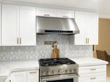 Modern kitchen with marble counters features the Proline PLJW 102 Range Hood—see ProlineRangeHoods.com for details.
