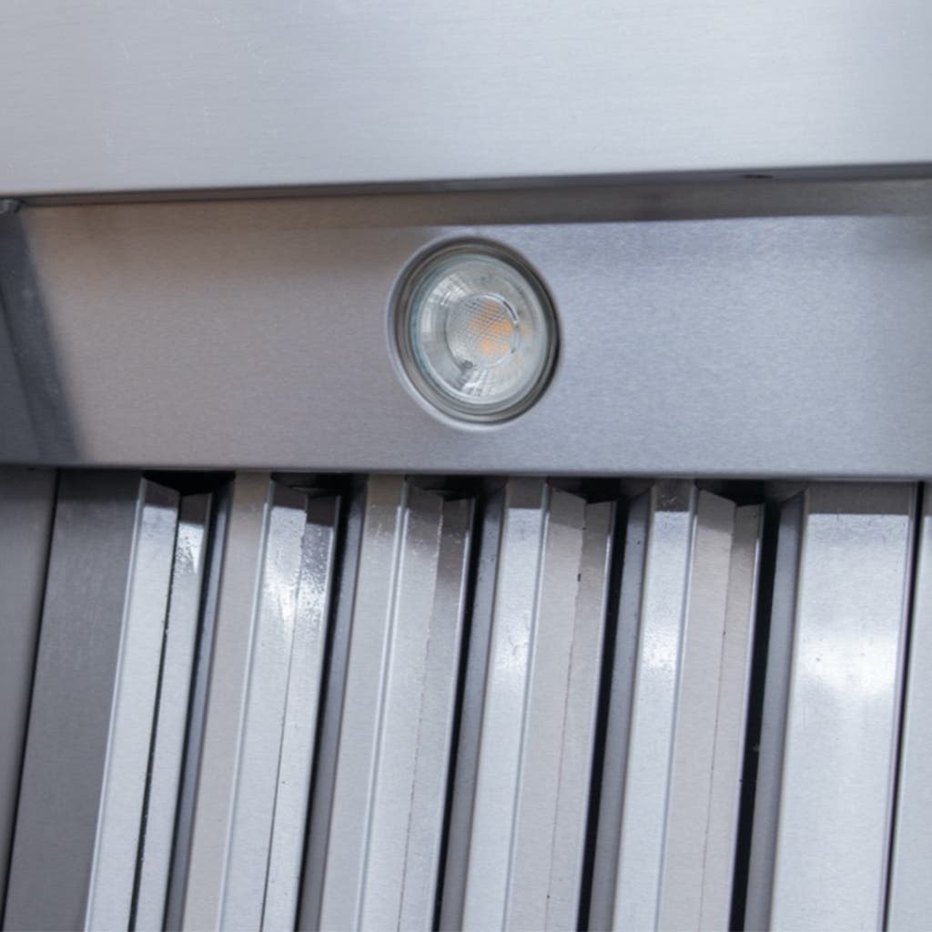 Close-up of the Proline PLJW 105 Under-Cabinet Range Hood from ProlineRangeHoods.com, with a small circular light above its metallic blades.