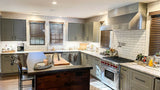 Smoke-free kitchen: gray cabinets, stainless steel finishes, wooden blinds & ProlineRangeHoods.com range hood for ventilation.