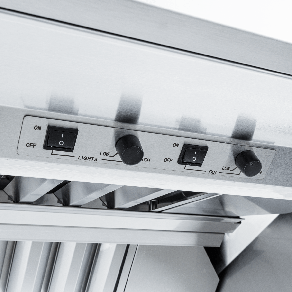 Close-up of Proline ProVI range hood control panel, switches and knobs, stainless steel finish. ProlineRangeHoods.com.