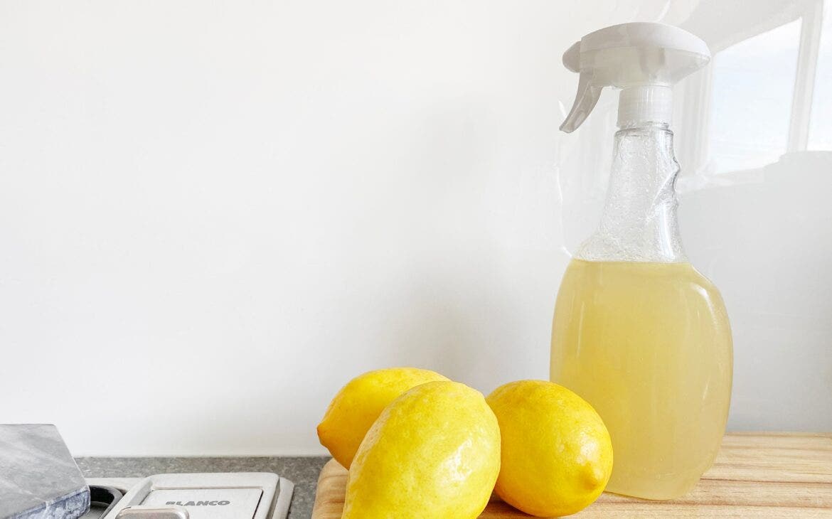 Lemons and Lemon Cleaner on A Counter - How to Properly Clean and Sanitize Your Kitchen