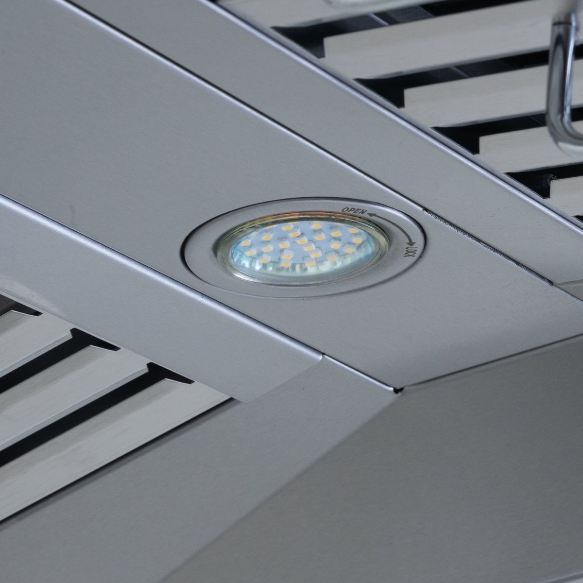 A 30-36" island range hood with outdoor-rated stainless steel, 1100 CFM ducted system by ProlineRangeHoods.com, in a metal grid ceiling with LCD touch control.