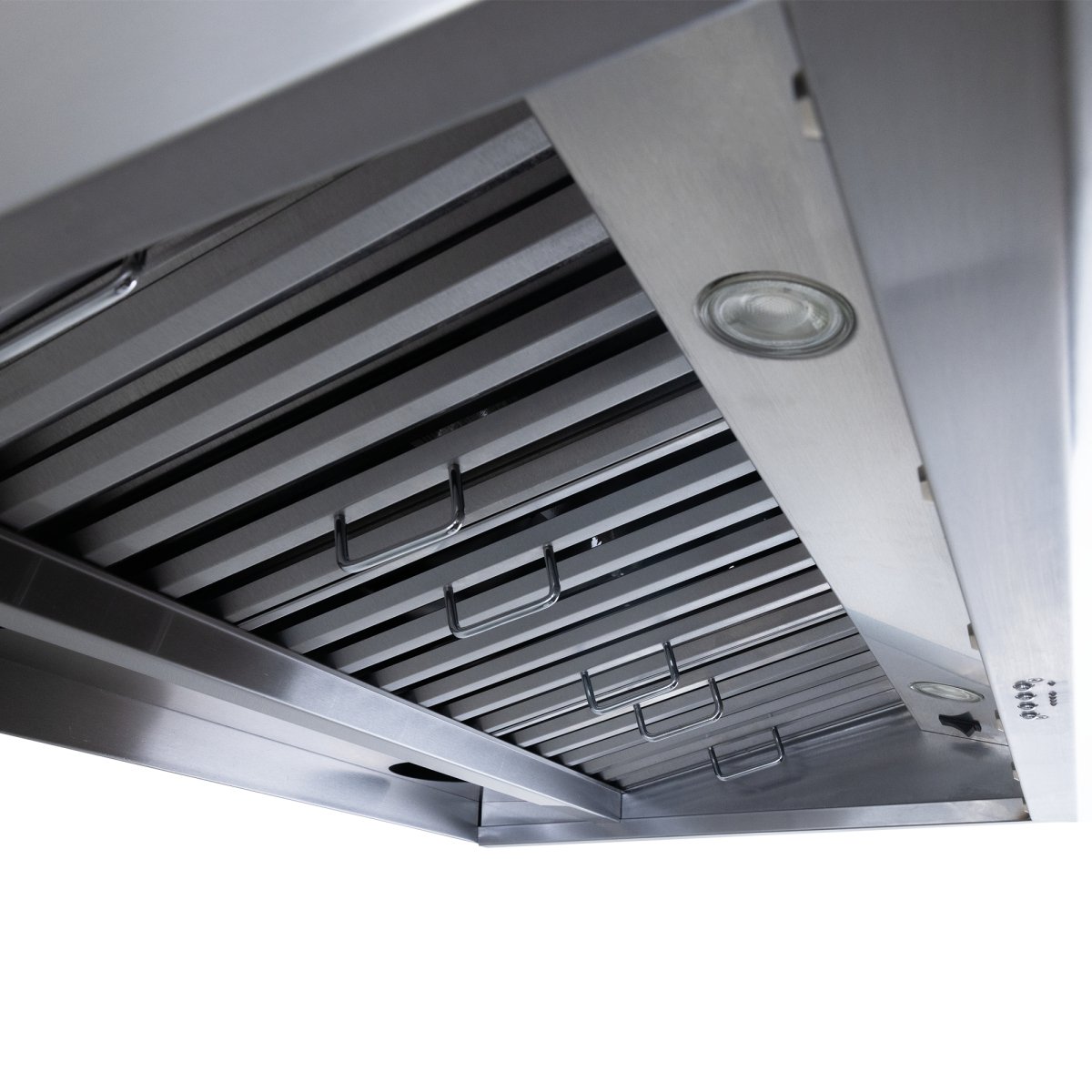 Underside view of the Proline Range Hoods 30-36 inch Wall-Mounted Range Hood (Model: PLJW 109) from ProlineRangeHoods.com, featuring slotted vents and a round light to showcase its 1000 CFM ventilation and quiet operation.