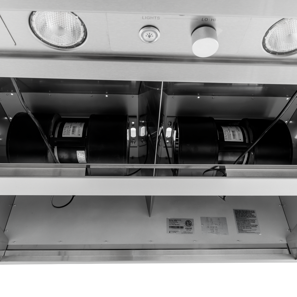 Underside of a PLGW BBQ ULTRA UC HE range hood with dual blowers, lights, and knobs. ProlineRangeHoods.com.