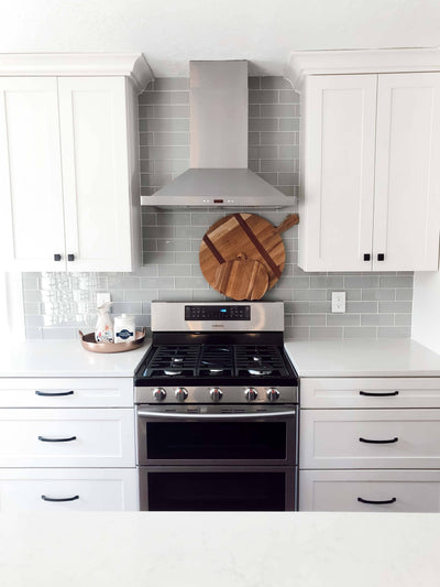 Customer kitchen with the Proline PLFW 520 - Wall-Mounted Range Hood, 600/1200 CFM | Convertible to Ductless, Stainless Steel, Matte Black Finish