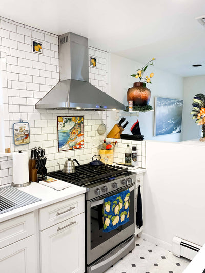 Customer kitchen with the Proline PLFW 129 J - Wall-Mounted Vent Hood, 900 CFM | Stainless Steel
