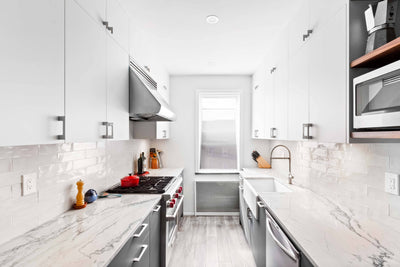 Customer kitchen with the Proline PLJW 109 - Wall-Mounted Range Hood, 1000/2000 CFM | Convertible to Ductless, Stainless Steel Finish, Outdoor Rated