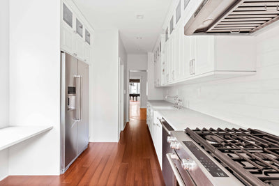 Customer kitchen with the Proline PLJW 113 - Under Cabinet Vent Hood, 900 CFM | Convertible to Ductless, Stainless Steel with Modern Control Panel