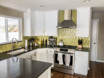 Customer kitchen with the Proline PLFW 129 E - Wall-Mounted Range Hood, 900 CFM | Stainless Steel Design